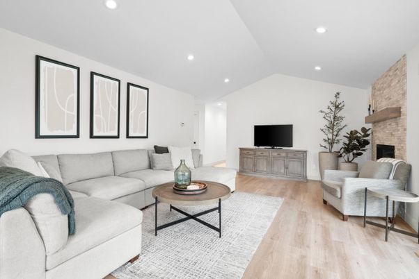 Fireplace, Interior, Living room, Recessed Lighting, Stone Walls, Wood Texture Flooring