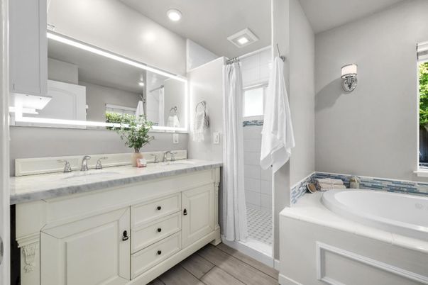 Bathroom, Dual Sink Vanities, Interior, Recessed Lighting, Tile Countertops, Wood Texture Flooring