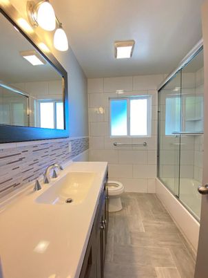 Bathroom, Dual Sink Vanities, Glass Shower, Interior, Wood Texture Flooring