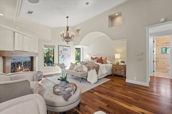 Bedroom, Chandelier, Fireplace, Interior, Living room, Recessed Lighting, Wood Texture Flooring