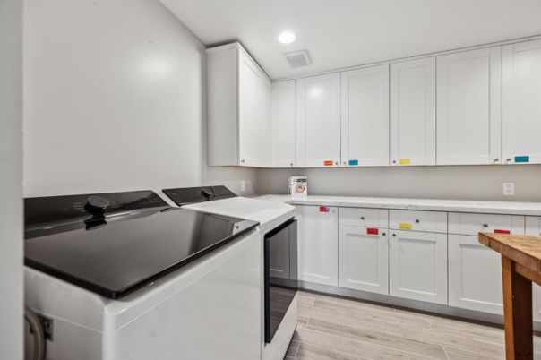 Interior, Kitchen, Recessed Lighting, Washer, Wood Texture Flooring