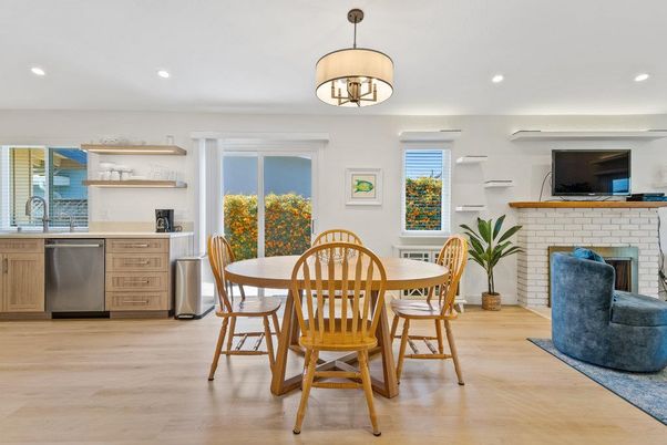 Dining room, Fireplace, Interior, Kitchen, Pendant Lights, Recessed Lighting, Stainless Steel Appliances, Stone Walls, Wood Texture Flooring