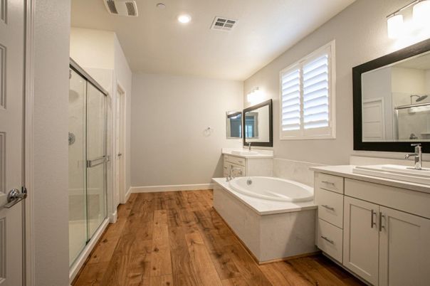Bathroom, Dual Sink Vanities, Glass Shower, Interior, Recessed Lighting, Wood Texture Flooring