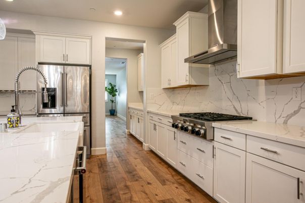 Interior, Kitchen, Marble Walls, Recessed Lighting, Stainless Steel Appliances, Wood Texture Flooring