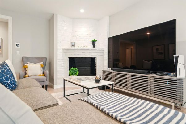 Fireplace, Interior, Living room, Recessed Lighting, Stone Walls, Wood Texture Flooring