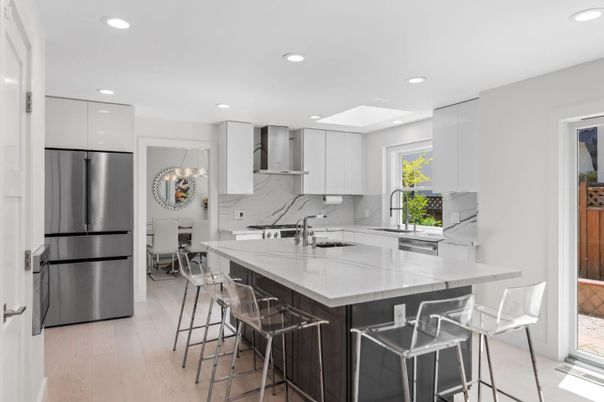 Interior, Kitchen, Marble Walls, Recessed Lighting, Stainless Steel Appliances, Wood Texture Flooring