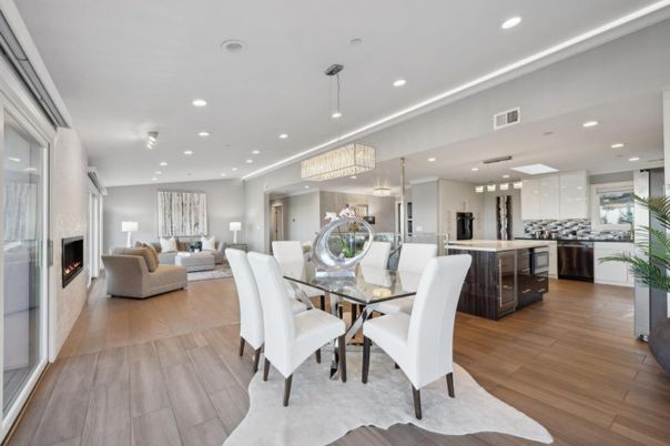 Chandelier, Dining room, Fireplace, Interior, Kitchen, Living room, Pendant Lights, Recessed Lighting, Stainless Steel Appliances, Wood Texture Flooring