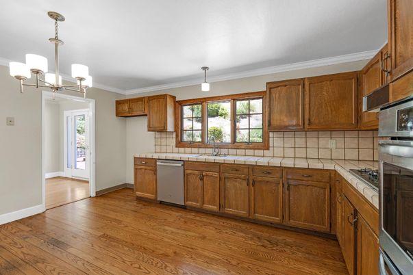 Chandelier, Interior, Kitchen, Tile Countertops, Wood Texture Flooring