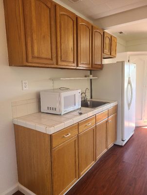Interior, Kitchen, Tile Countertops, Wood Texture Flooring