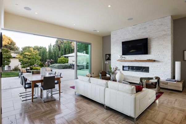 Dining room, Fireplace, Interior, Living room, Recessed Lighting, Stone Walls, Wood Texture Flooring