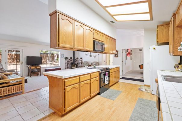 Interior, Kitchen, Tile Countertops, Wood Texture Flooring