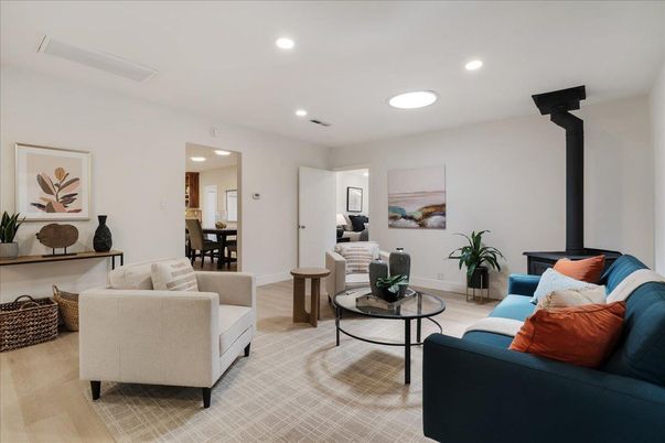 Dining room, Fireplace, Interior, Living room, Recessed Lighting, Wood Texture Flooring