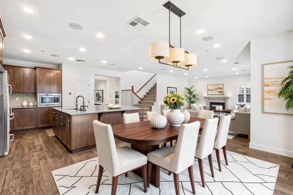 Chandelier, Dining room, Fireplace, Interior, Kitchen, Living room, Pendant Lights, Recessed Lighting, Stainless Steel Appliances, Wood Texture Flooring