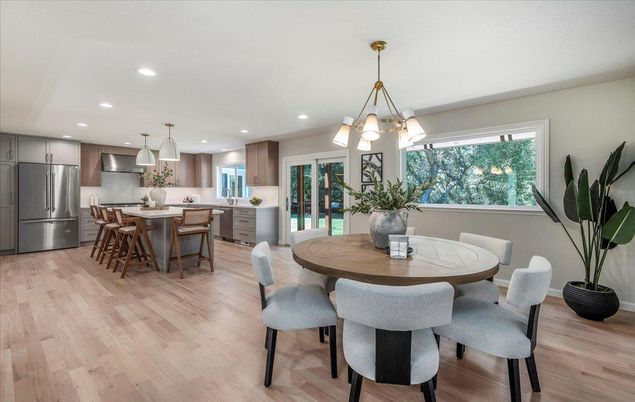 Chandelier, Dining room, Interior, Kitchen, Pendant Lights, Recessed Lighting, Stainless Steel Appliances, Wood Texture Flooring