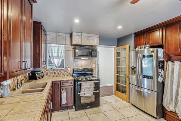 Interior, Kitchen, Recessed Lighting, Stainless Steel Appliances, Tile Countertops