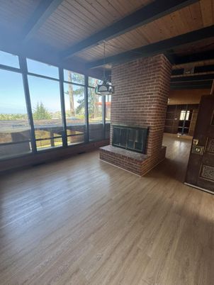 Empty room, Fireplace, Interior, Pendant Lights, Stone Walls, Wooden Beams, Wooden Ceilings, Wood Texture Flooring