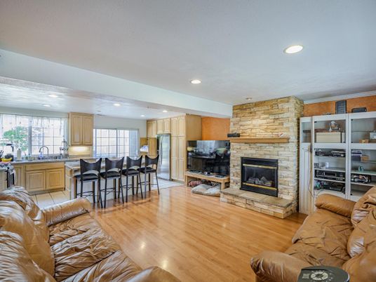 Fireplace, Interior, Kitchen, Living room, Recessed Lighting, Stone Walls, Wood Texture Flooring