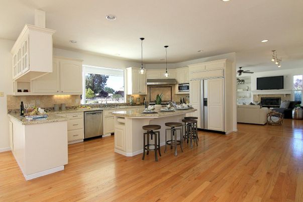Fireplace, Interior, Kitchen, Living room, Pendant Lights, Recessed Lighting, Stainless Steel Appliances, Wood Texture Flooring