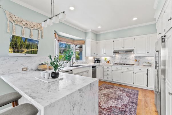 Interior, Kitchen, Marble Walls, Pendant Lights, Recessed Lighting, Stainless Steel Appliances, Wood Texture Flooring