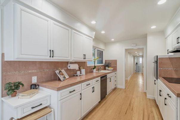Interior, Kitchen, Recessed Lighting, Tile Countertops, Wood Texture Flooring