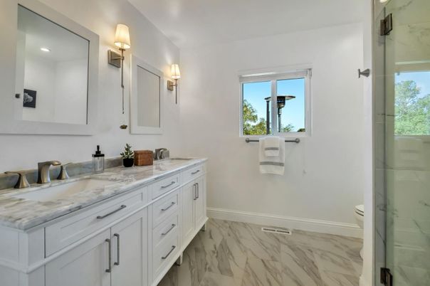 Bathroom, Dual Sink Vanities, Glass Shower, Interior, Marble, Marble Walls, Recessed Lighting