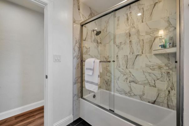 Bathroom, Glass Shower, Interior, Marble Walls, Wood Texture Flooring