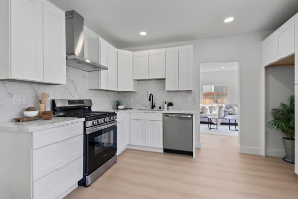 Interior, Kitchen, Marble Walls, Recessed Lighting, Stainless Steel Appliances, Wood Texture Flooring