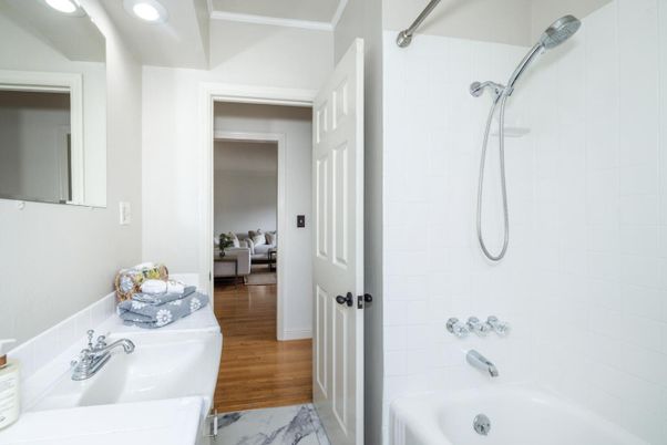 Bathroom, Dual Sink Vanities, Interior, Marble, Recessed Lighting, Wood Texture Flooring