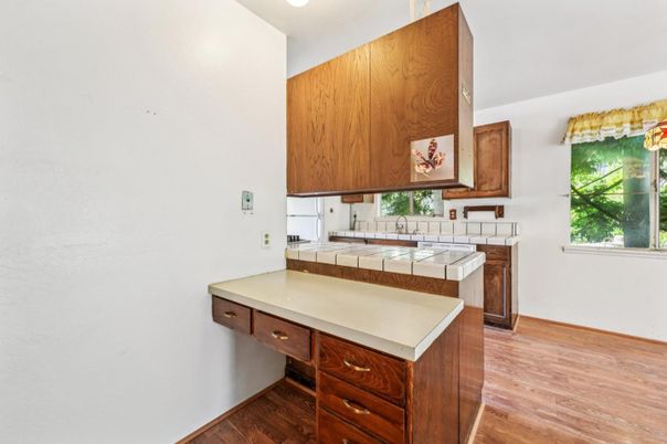 Interior, Kitchen, Recessed Lighting, Tile Countertops, Wood Texture Flooring