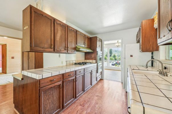 Interior, Kitchen, Tile Countertops, Wood Texture Flooring