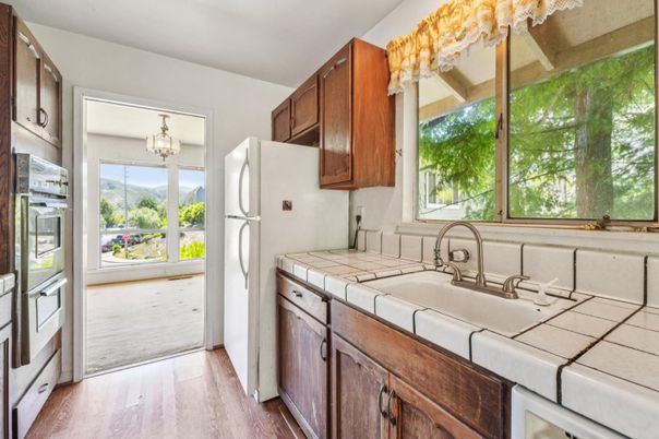 Chandelier, Interior, Kitchen, Tile Countertops, Wood Texture Flooring