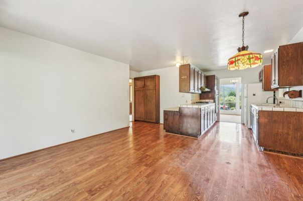 Interior, Kitchen, Pendant Lights, Tile Countertops, Wood Texture Flooring