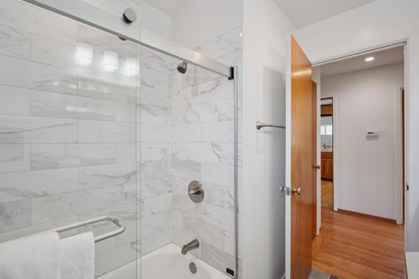 Bathroom, Glass Shower, Interior, Marble Walls, Recessed Lighting, Wood Texture Flooring