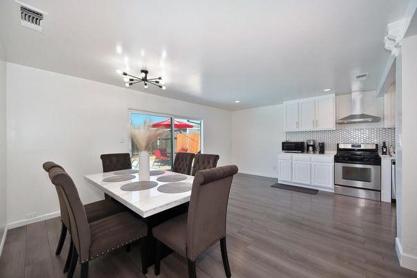 Dining room, Interior, Kitchen, Pendant Lights, Recessed Lighting, Stainless Steel Appliances, Wood Texture Flooring