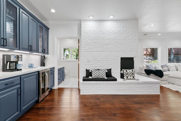 Fireplace, Interior, Kitchen, Living room, Recessed Lighting, Stone Walls, Wood Texture Flooring