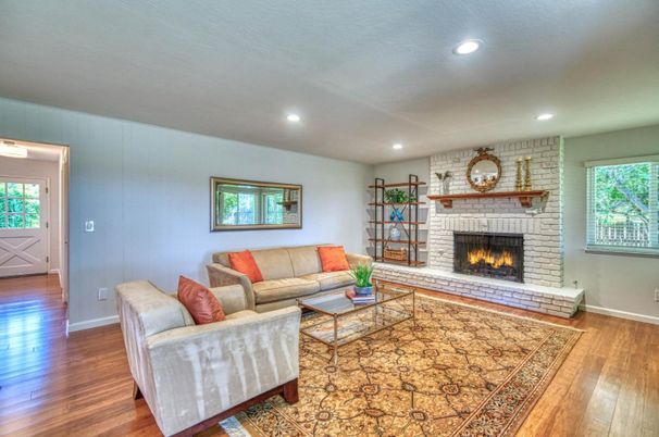 Fireplace, Interior, Living room, Recessed Lighting, Stone Walls, Wood Texture Flooring