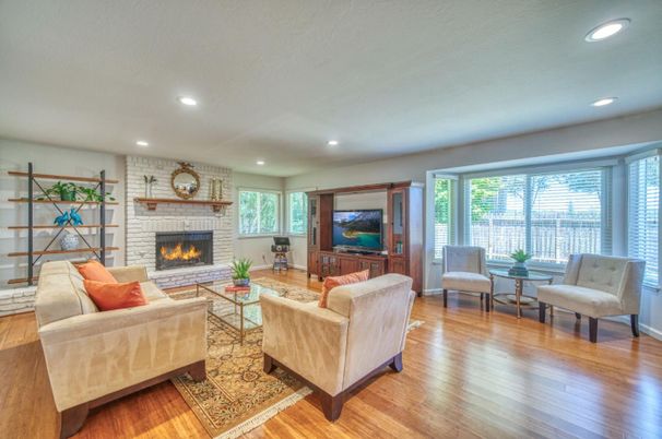 Fireplace, Interior, Living room, Recessed Lighting, Stone Walls, Wood Texture Flooring