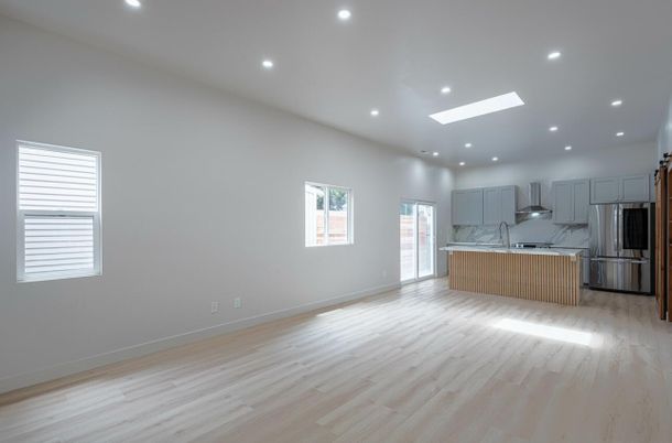Interior, Kitchen, Marble Walls, Recessed Lighting, Stainless Steel Appliances, Wood Texture Flooring