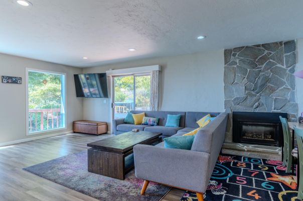 Fireplace, Interior, Living room, Recessed Lighting, Stone Walls, Wood Texture Flooring