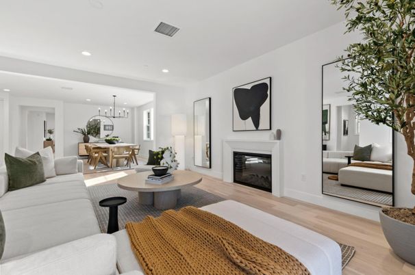 Chandelier, Dining room, Fireplace, Interior, Living room, Pendant Lights, Recessed Lighting, Wood Texture Flooring