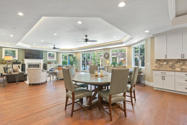 Dining room, Fireplace, Interior, Living room, Recessed Lighting, Wood Texture Flooring