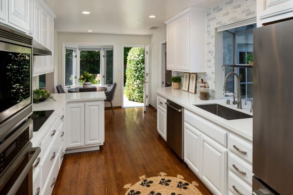 Dining room, Interior, Kitchen, Recessed Lighting, Stainless Steel Appliances, Stone Walls, Wood Texture Flooring