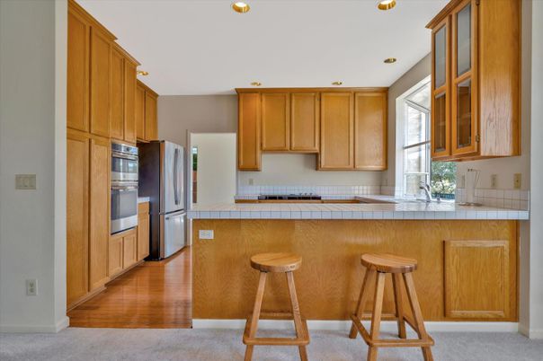 Interior, Kitchen, Recessed Lighting, Tile Countertops, Wood Texture Flooring