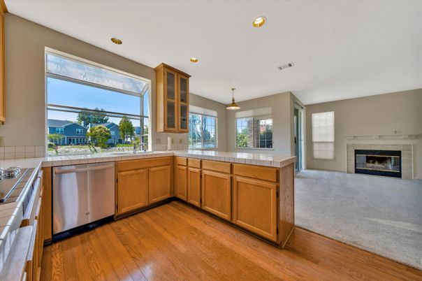 Fireplace, Interior, Kitchen, Pendant Lights, Recessed Lighting, Tile Countertops, Wood Texture Flooring