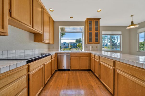 Interior, Kitchen, Pendant Lights, Recessed Lighting, Tile Countertops, Wood Texture Flooring