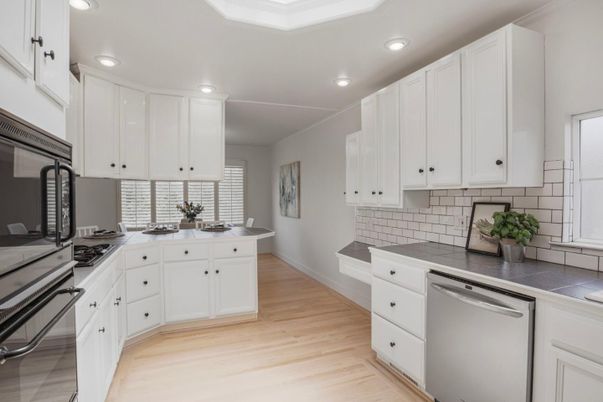 Interior, Kitchen, Recessed Lighting, Tile Countertops, Wood Texture Flooring