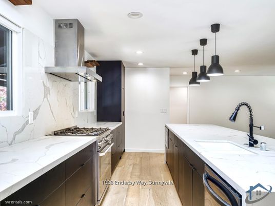Interior, Kitchen, Marble Walls, Pendant Lights, Recessed Lighting, Stainless Steel Appliances, Wood Texture Flooring