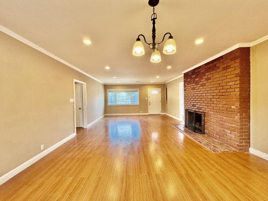 Empty room, Fireplace, Interior, Recessed Lighting, Stone Walls, Wood Texture Flooring