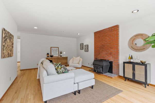 Fireplace, Interior, Living room, Recessed Lighting, Stone Walls, Wood Texture Flooring