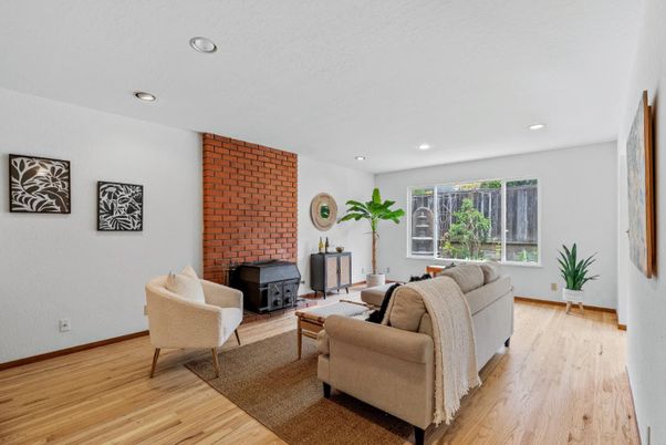 Fireplace, Interior, Living room, Recessed Lighting, Stone Walls, Wood Texture Flooring